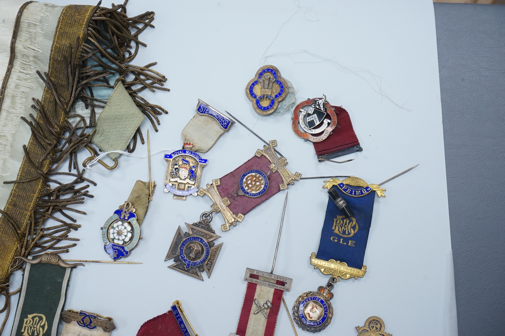 A group of Masonic medals, ‘jewels’ many enamelled and sashes, together with an early 19th century certificate